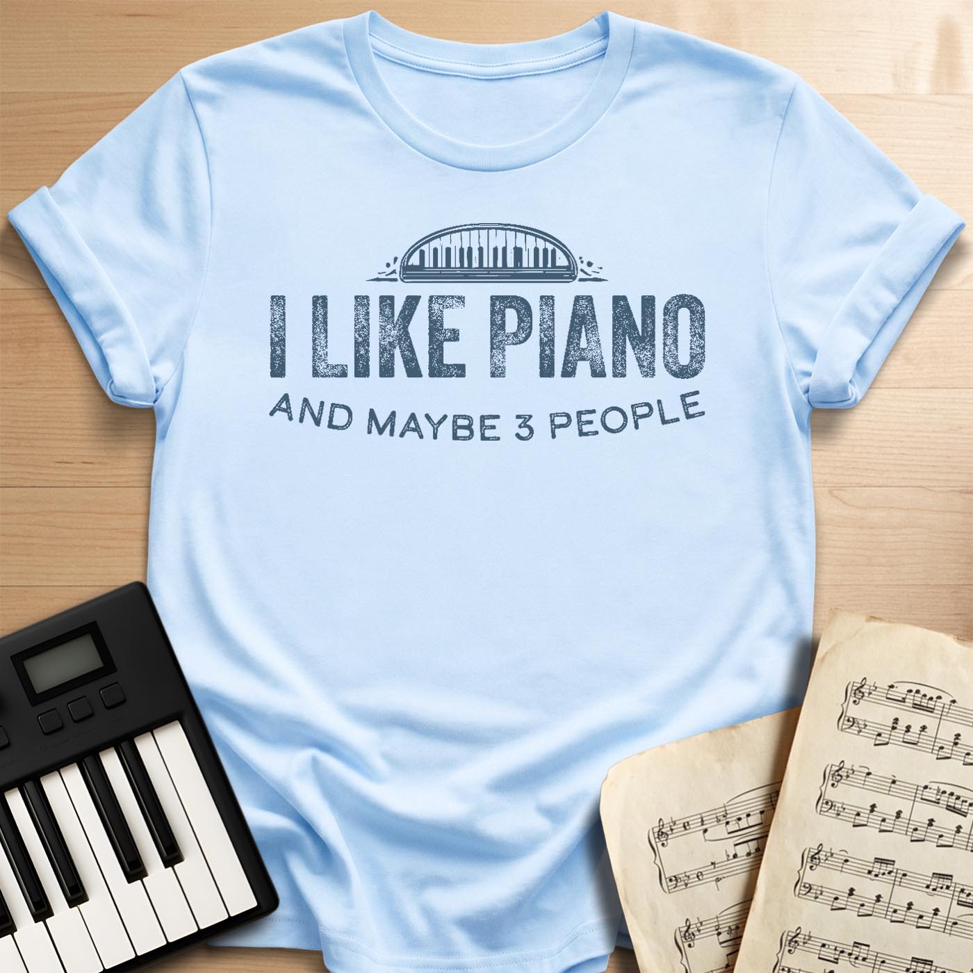 Light blue I Like Piano And Maybe 3 People t-shirt with distressed piano keyboard graphic, funny gift for pianists